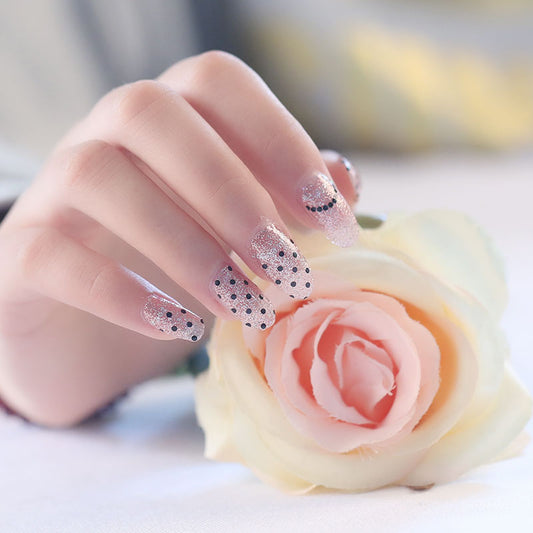 Paillettes dorées à pois noirs