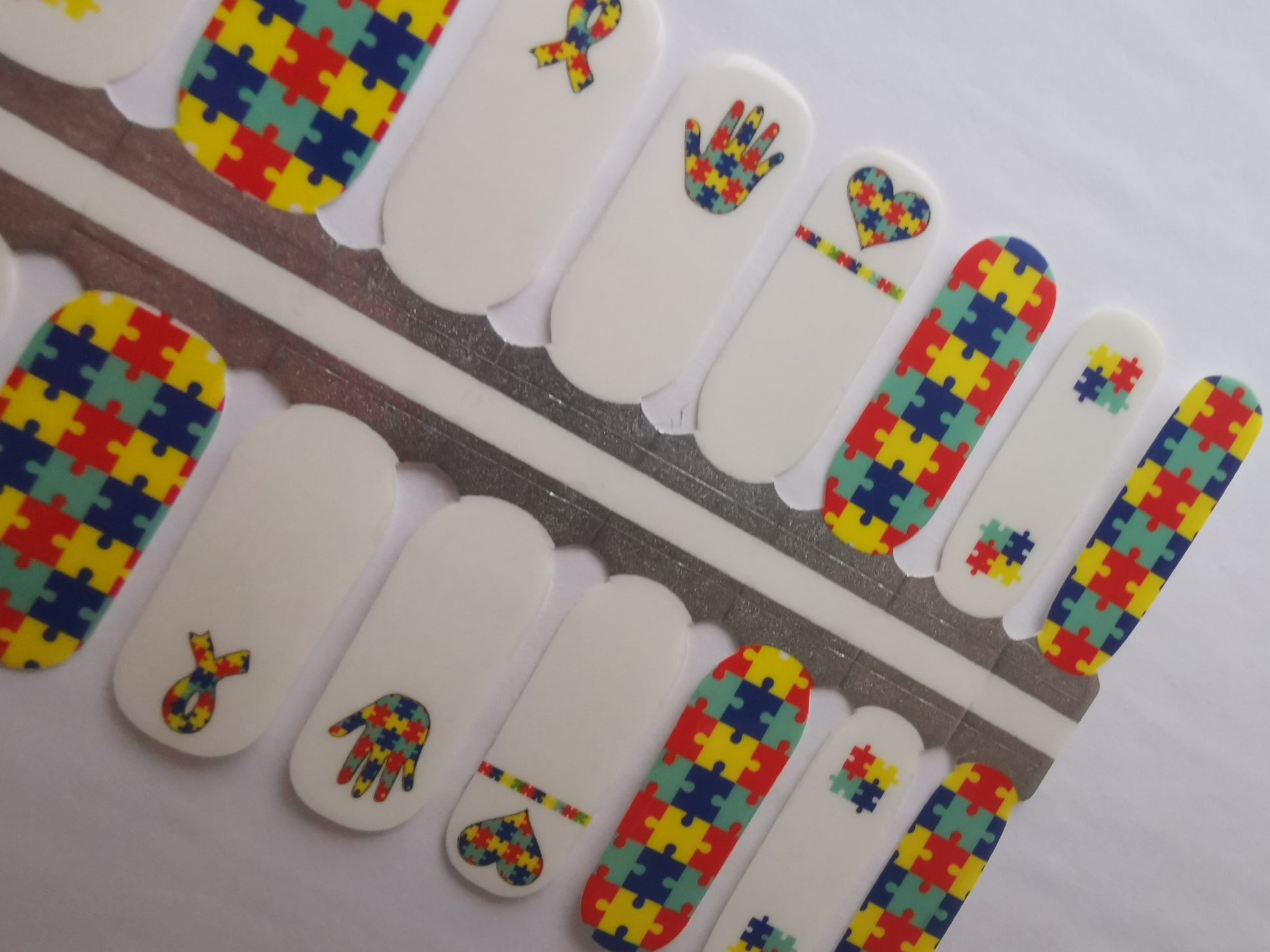 Light Gray Autism Awareness Heart Hand Puzzles Blue Yellow Red